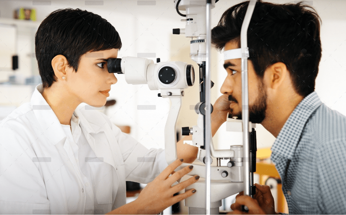 optometrist examining patient in modern RXUVD5T